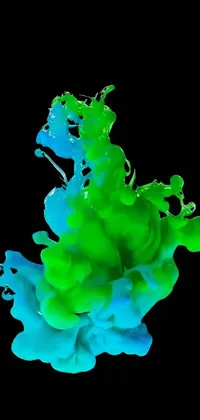 This phone live wallpaper showcases a close-up view of green and blue liquid, creating an artful and mesmerizing effect inspired by modern artists