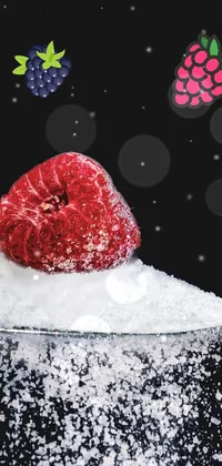 This phone live wallpaper has a sweet, striking composition featuring a spoon filled with sugar, topped with a beautiful raspberry from Pexels