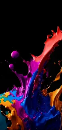 This dynamic and colorful phone live wallpaper features a splash of paint on a black background