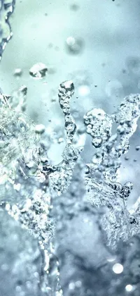 This phone live wallpaper features a stunning glass of water with Swarovski crystals embedded in it