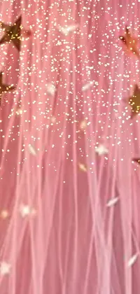 Bring a magical touch to your phone with this live wallpaper – a bed with a pink canopy decorated with gold stars, netting and adorable emojis