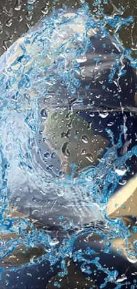 This mobile wallpaper features an animated drop of water showcasing a breathtaking photorealistic painting of the earth within it