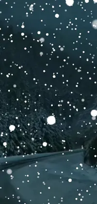 This phone live wallpaper showcases a stunning snowy landscape