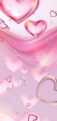 The phone live wallpaper showcases a collection of vector art hearts in motion, surrounded by flowing pink-colored silk