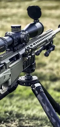This live wallpaper features a close-up of a rifle mounted on a sturdy tripod, exuding an aura of power and weaponry