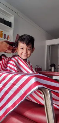 This live wallpaper depicts a man cutting a young boy's hair in a classic barbershop
