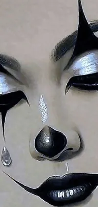 This black and white live wallpaper features a mesmerizing drawing of a clown's face