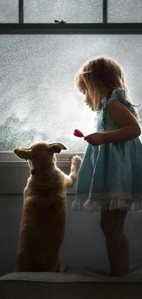 This phone live wallpaper features a heartwarming conceptual art of a little girl standing next to a dog in front of a window