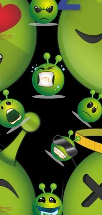 This phone live wallpaper showcases a playful bunch of green emoticons enjoying a delicious alien meal against a sleek black backdrop
