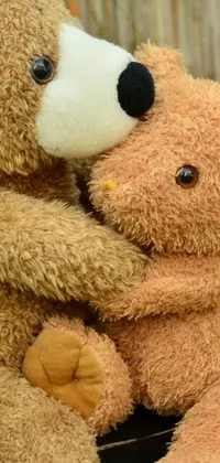 Looking for a phone live wallpaper that's cute and charming? Look no further than this adorable option featuring two teddy bears! The bears are captured in a beautiful closeup shot, giving you a clear view of their loving embrace