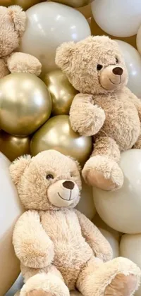 This charming live wallpaper features a delightful group of teddy bears sitting atop a colorful pile of balloons