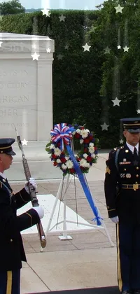 This live wallpaper features two men standing beside each other with a backdrop of flickering tomb lights and US soldier memorabilia