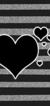 This live wallpaper features a black and white striped background with scattered hearts