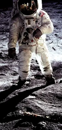 This live wallpaper features a breathtaking photograph of an astronaut walking on the surface of the moon