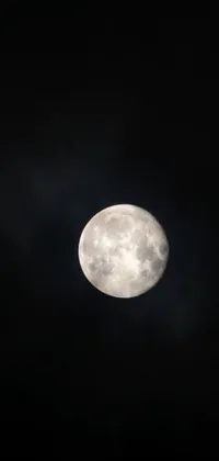 This live wallpaper captures the mesmerizing beauty of a full moon amidst dark clouds and swirling vortex