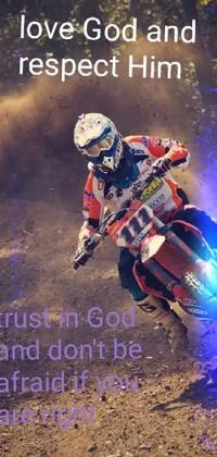This phone wallpaper showcases a breath-taking image of a rider on a dirt bike in protective gear, traversing a mountainous terrain