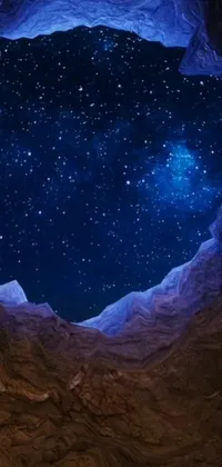 Elevate your phone screen with our mesmerizing live wallpaper featuring a sky full of glittering stars against a natural cave wall