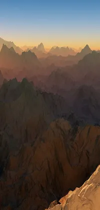This phone live wallpaper showcases a stunning digital art piece of an aerial view of a snowy mountain at sunrise