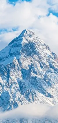 Experience the thrill of skiing down a majestic snow-covered mountain with this live wallpaper for your phone