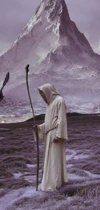 This live wallpaper features a purple robed figure holding a scythe in front of a mountain