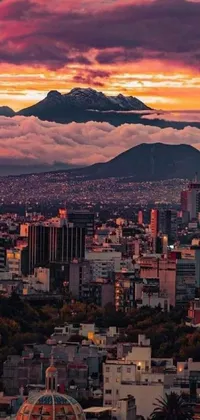 This phone live wallpaper is a stunning depiction of a colorful sunset in a city with a mountain in the background