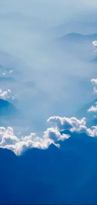 This stunning phone live wallpaper showcases an aerial view of mountains and clouds, capturing the natural beauty of God's creation