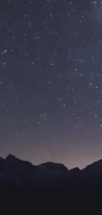 Elevate your phone's background with this stunning live wallpaper featuring a mesmerizing night sky twinkling with countless stars