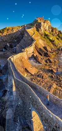 Looking for a phone live wallpaper that will take your breath away? Look no further than this awe-inspiring image of a medieval castle on a cliff overlooking the ocean