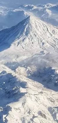 This stunning phone live wallpaper features a snow-covered mountain view from an airplane that leaves an everlasting impression