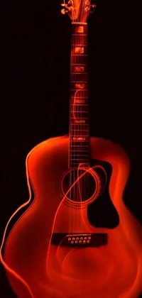 This phone live wallpaper showcases a close up view of a guitar in the dark