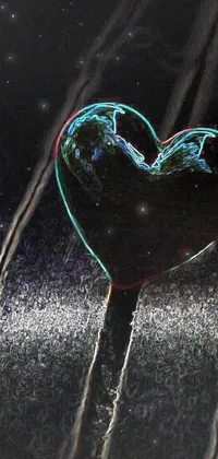 This enchanting phone wallpaper features a stunning glass heart, perched on a wooden table and enhanced with digital art