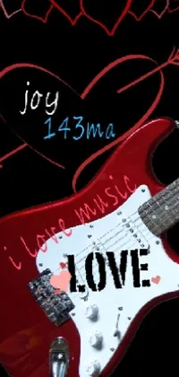This phone live wallpaper features a stunning red guitar with the word "love" on it