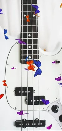 This live wallpaper for your phone showcases a beautifully detailed, white electric bass guitar on a high-resolution background