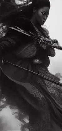 This phone live wallpaper features a striking black and white photograph of a woman holding two swords