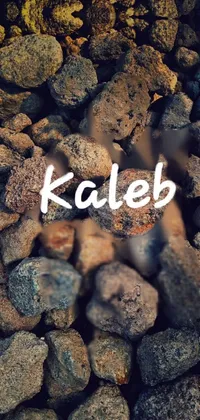 This captivating live wallpaper features a striking pile of rocks adorned with the word "Kaleb", surrounded by Kemetic symbols
