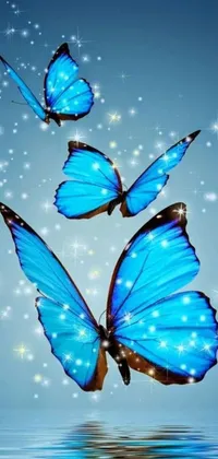 This live wallpaper for smartphones depicts three beautiful blue butterflies soaring over a tranquil body of water surrounded by lush vegetation