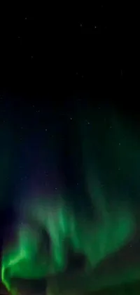 This live phone wallpaper showcases the stunning aurora borealis illuminating the night sky with vibrant colors
