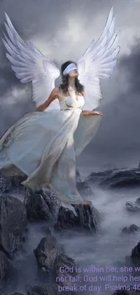 This stunning live wallpaper features a mystical woman in a white dress standing on a rock, her face covered by an angel halo and her wings made of dark clouds