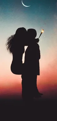 This lively live phone wallpaper features a silhouette of a figure holding a sparkler that creates a magical ambiance