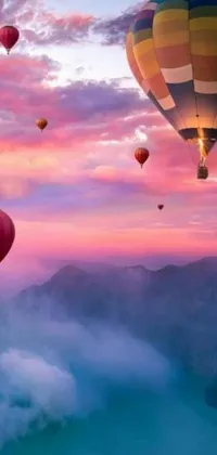 This live wallpaper features a group of hot air balloons soaring above a mountainous landscape, creating a romantic and dreamy atmosphere