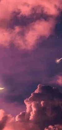 This live phone wallpaper captures a magical scene of airplanes soaring through a pink cloudy sky, featuring a shooting star, full moon, and candle