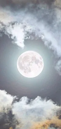 This phone live wallpaper depicts a breathtaking full moon in a cloudy night sky