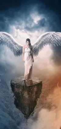 This phone live wallpaper features a captivating digital art of a woman in a white dress, standing on top of a cliff with two pairs of wings - one white and one black