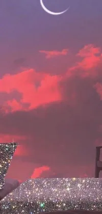 This live wallpaper features a calm bedroom scene with a bed in the center under a pink sky