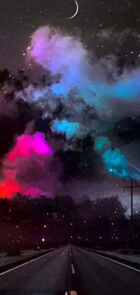 Transform your phone screen with a stunning live wallpaper featuring an empty road at night under the moon, a colorized photo by David Michie, complete with space art, brightly colored smoke, a baroque painting overlay, starlit sky, and a colorful nebula