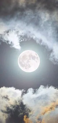 This captivating phone live wallpaper features a beautiful full moon set against a cloudy, blue sky