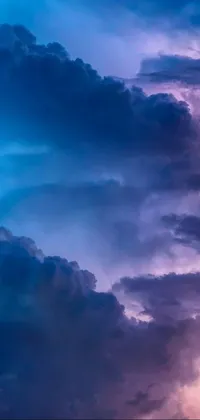 This beautiful live wallpaper depicts a dramatic stormy sky filled with drifting clouds