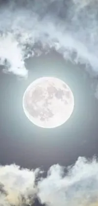 This stunning phone live wallpaper features a full moon in a cloudy sky, with dynamic moving clouds creating a moody and atmospheric scene