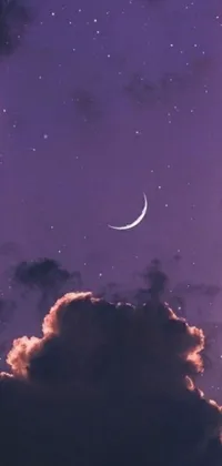 Add a touch of serenity to your phone with this stunning purple sky live wallpaper featuring a crescent moon