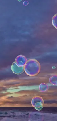 This phone live wallpaper depicts soft lilac skies and a collection of soap bubbles that effortlessly float in the air